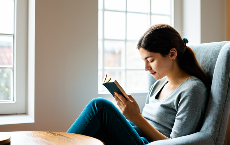 Peaceful Digital Detox**
"A woman is sitting in a cozy armchair by a window, reading a book. The room is bathed in soft, natural light. A cup of tea sits on a nearby table. Her smartphone is placed face down, slightly out of focus, in the background. Fully clothed in comfortable, modest attire. Serene, peaceful, safe for work, appropriate content, perfect anatomy, correct proportions, professional photography, family-friendly."
**